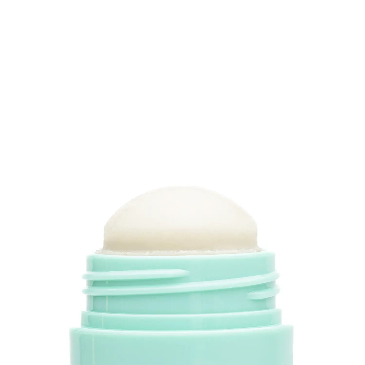 Close-up of a cosmetic Italian vegan brand makeup cleansing balm stick named IRL cream-colored swatch. Daily Dose.