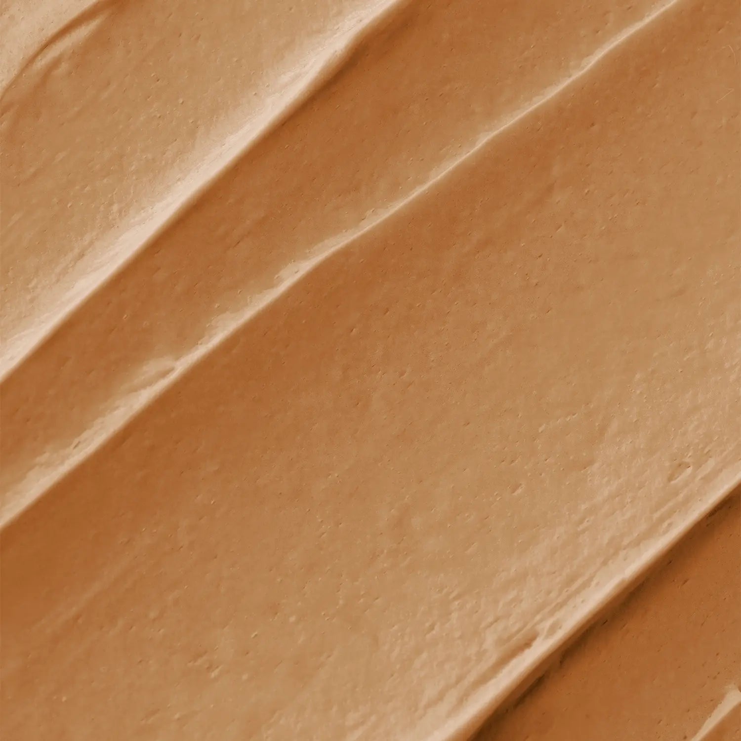 A brown-colored makeup bronzer swatch with a textured surface of Daily Dose a cosmetic vegan Italian brand.