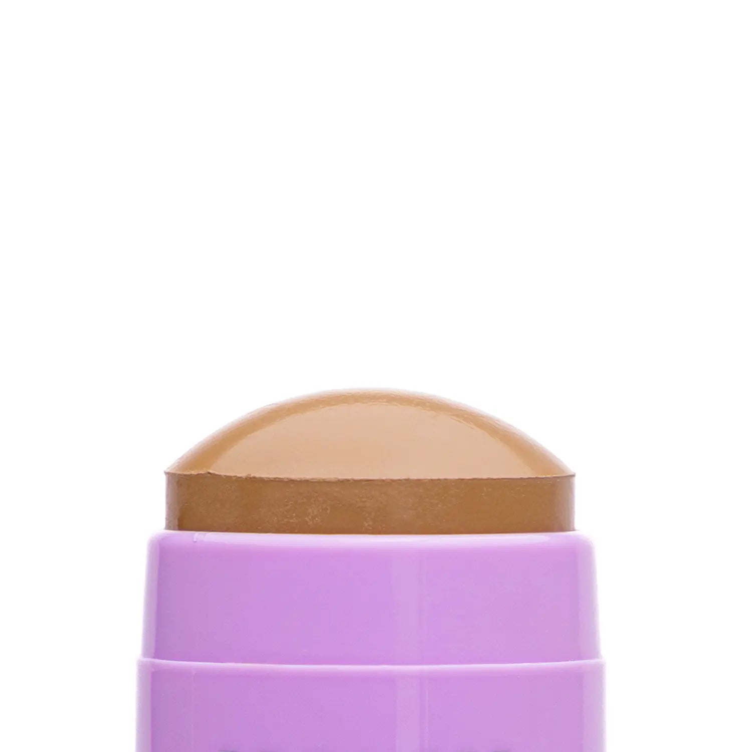 Close-up of a cosmetic Italian vegan makeup bronzer stick named FYP bronze-colored swatch with a textured surface. Daily Dose.