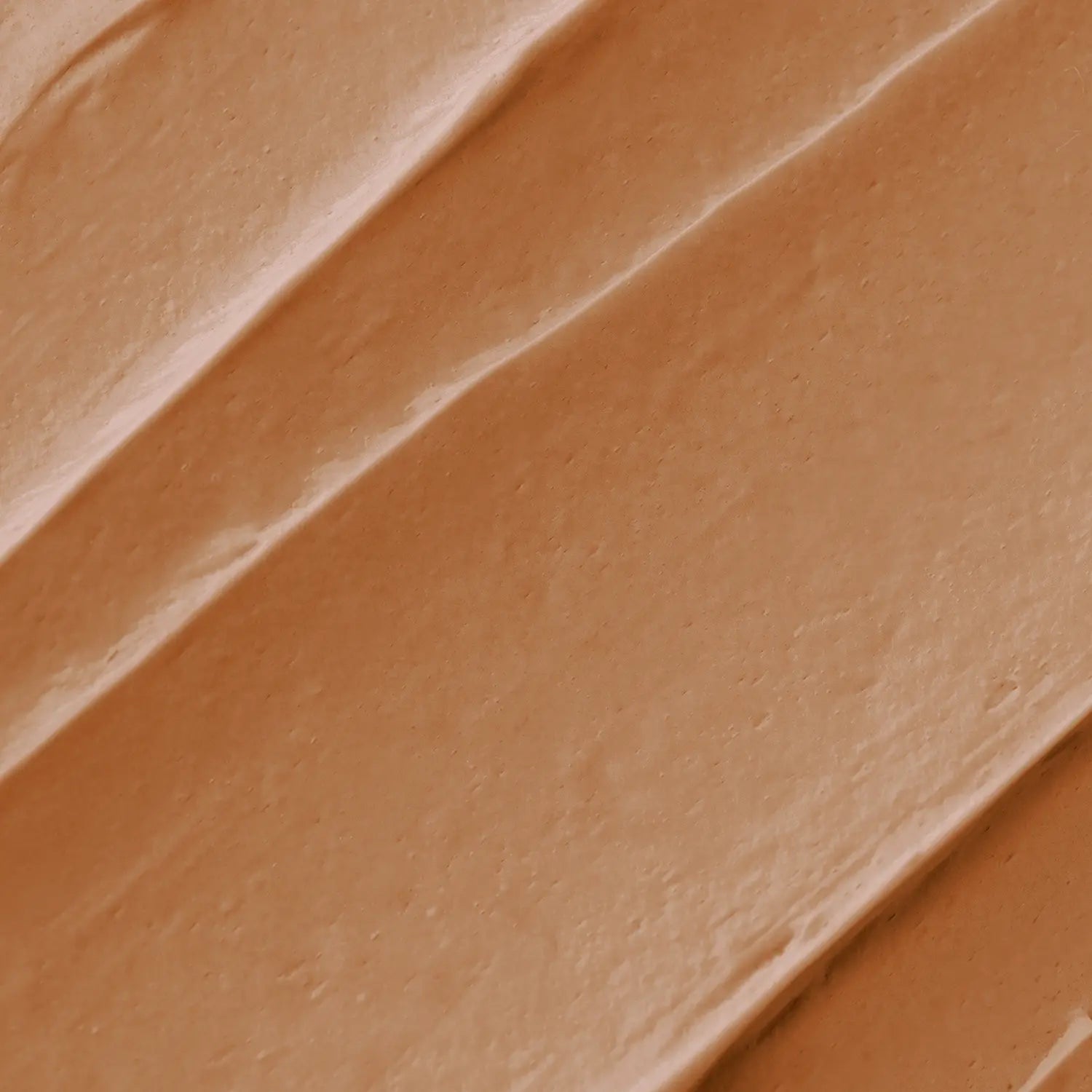 A brown-colored makeup bronzer swatch with a textured surface of Daily Dose a cosmetic vegan Italian brand
