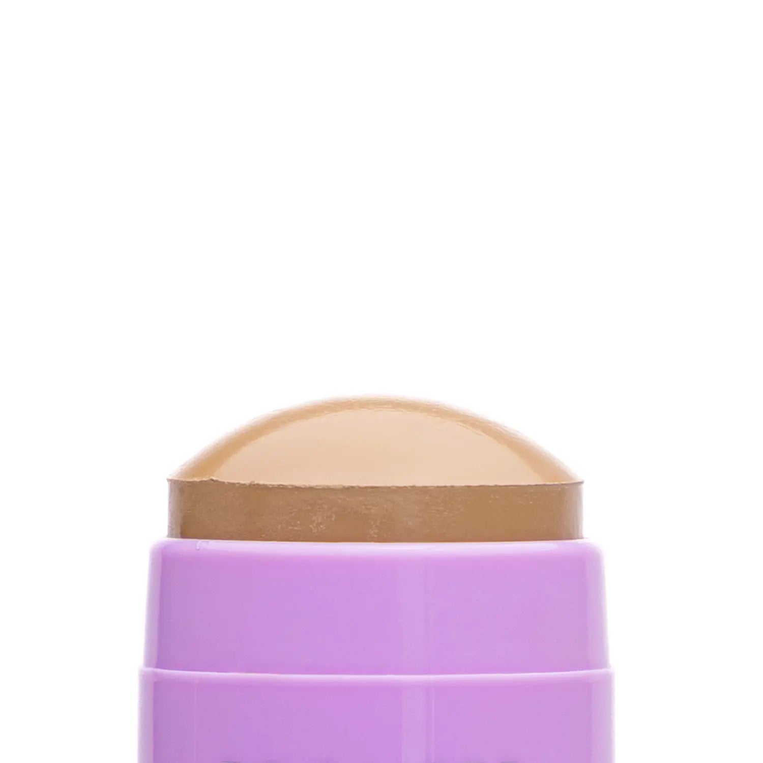 Close-up of a cosmetic Italian vegan makeup bronzer stick named JW brown-colored swatch with a textured surface. Daily Dose.