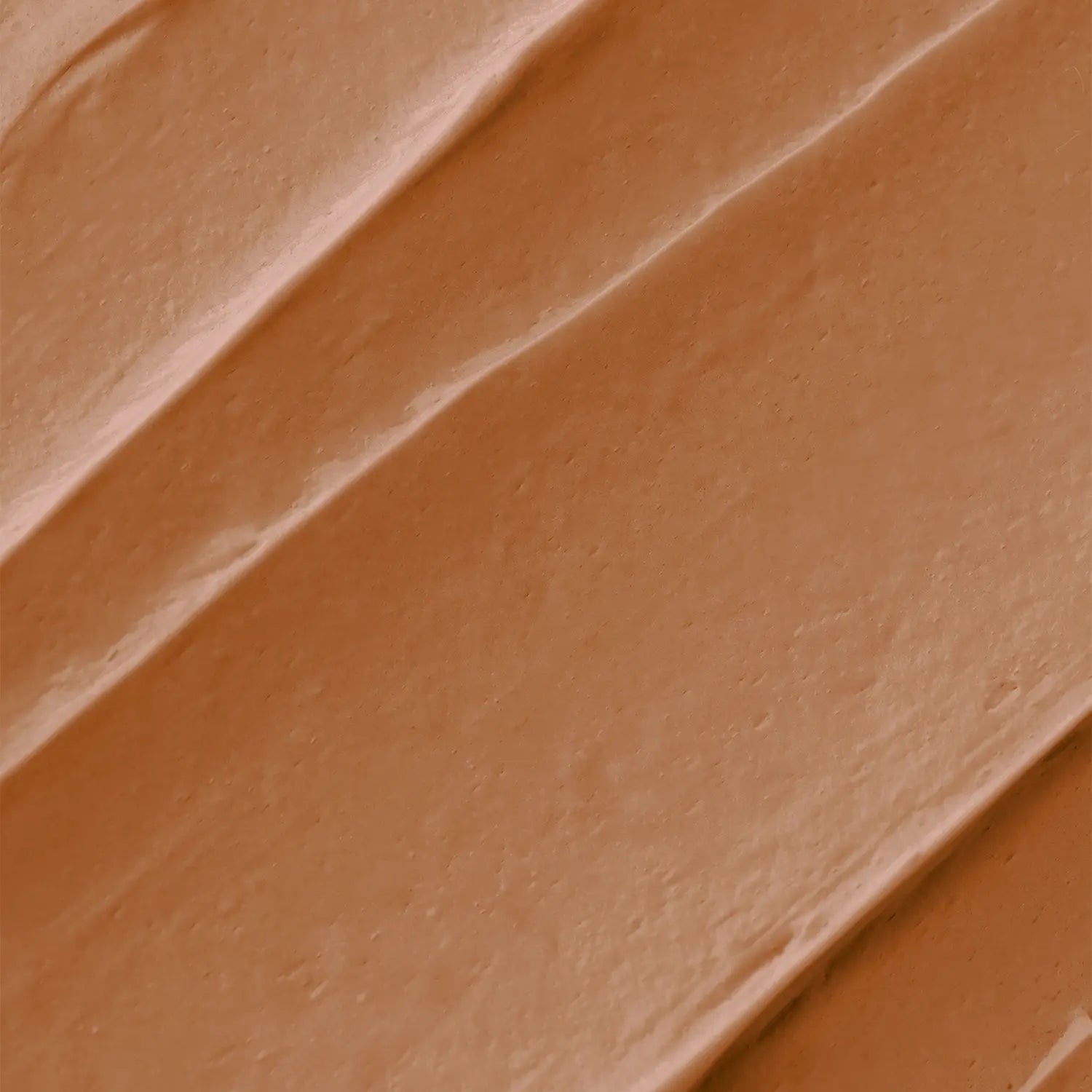 A chocolate-colored makeup bronzer swatch with a textured surface of Daily Dose a cosmetic vegan Italian brand.